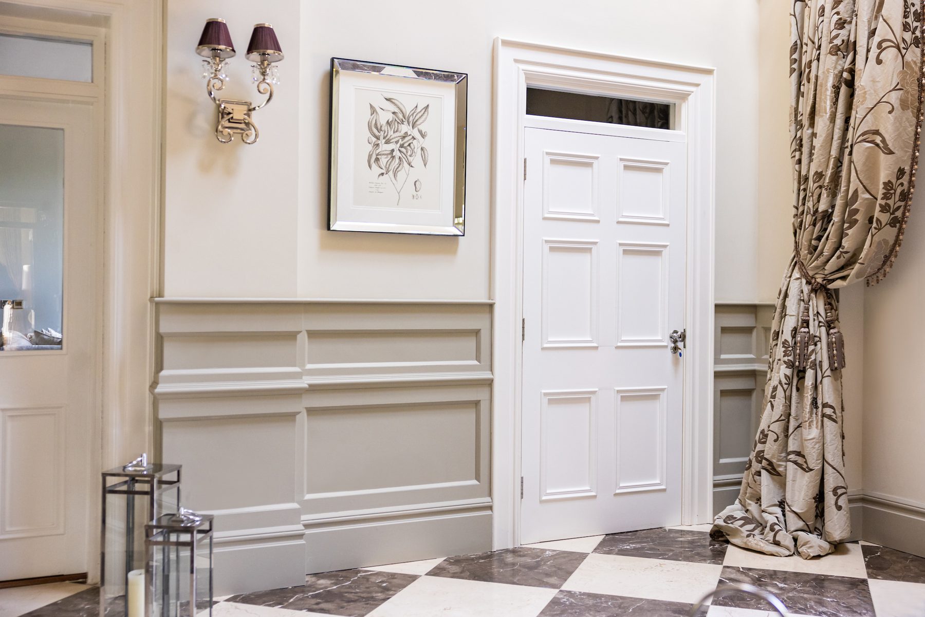 Painted panelling, skirting and architrave in a period hallway